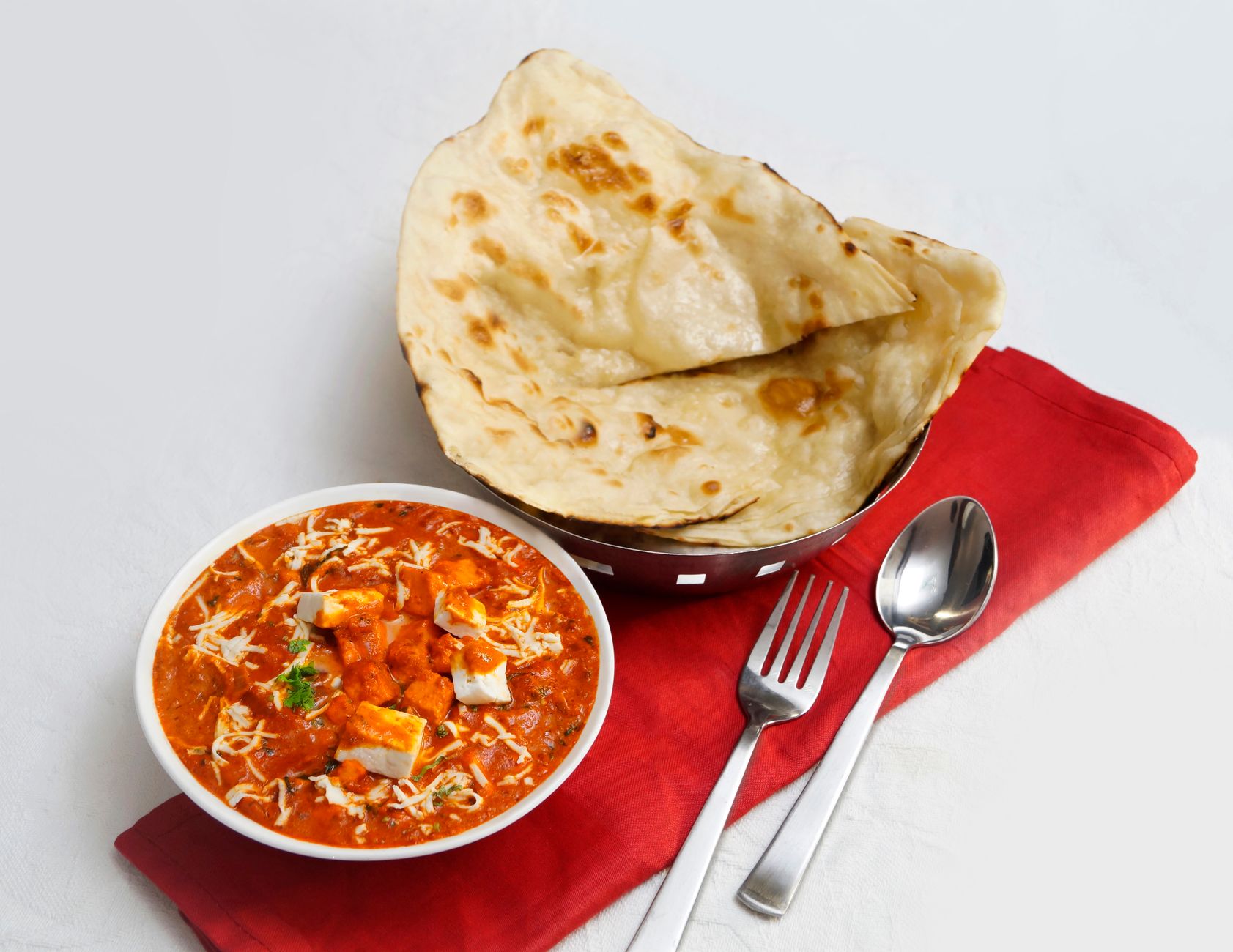 Paneer curry served with fresh bread